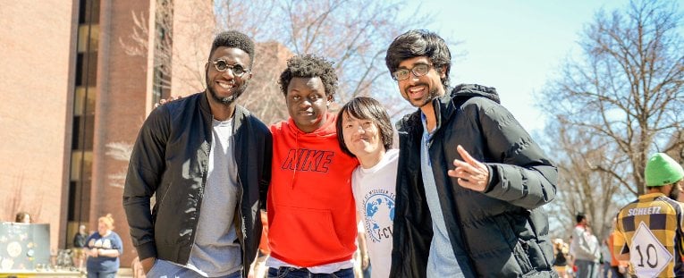 International students posing on campus.