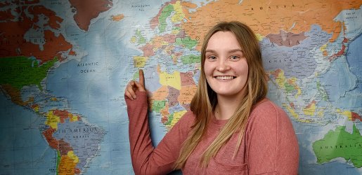 Student pointing to a map