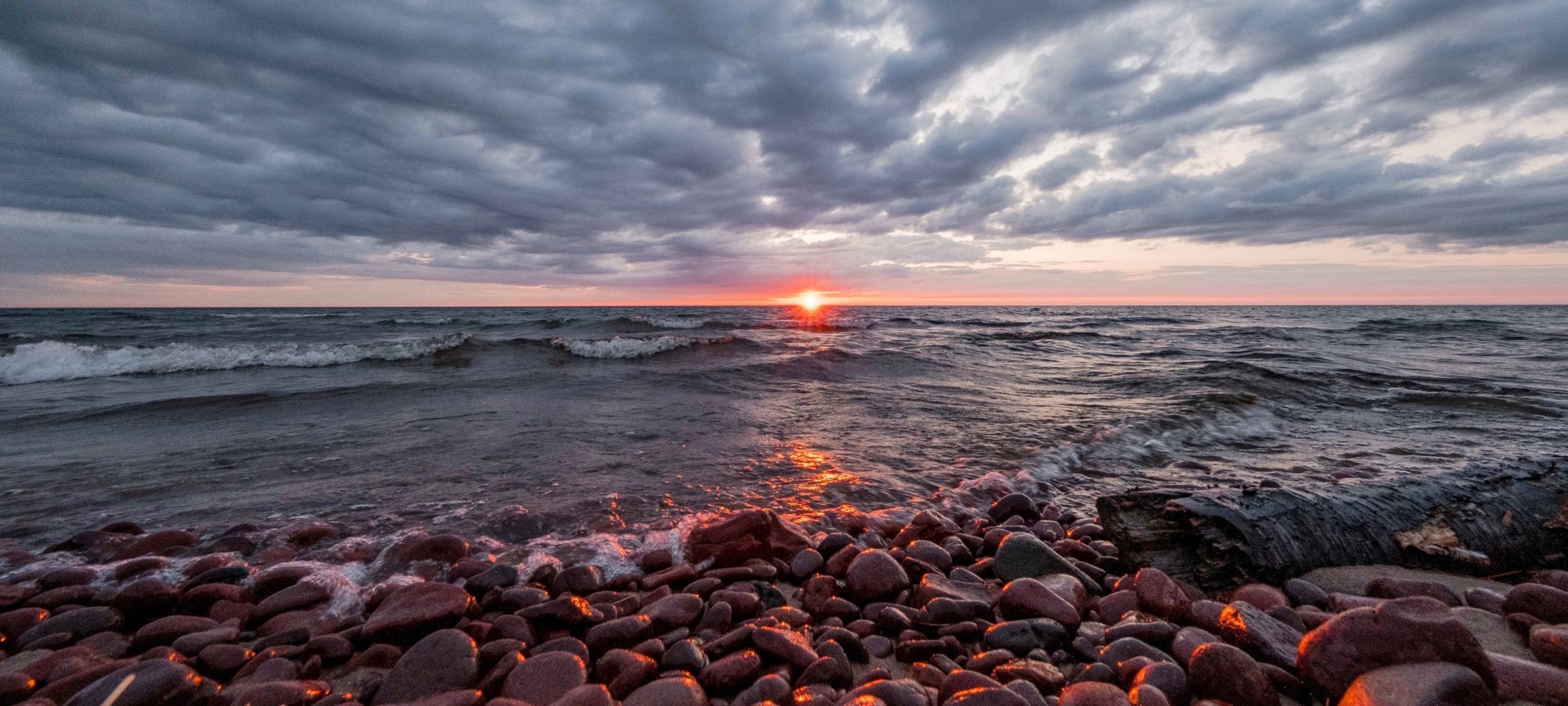 A beach at Eagle River, MI at sunset.