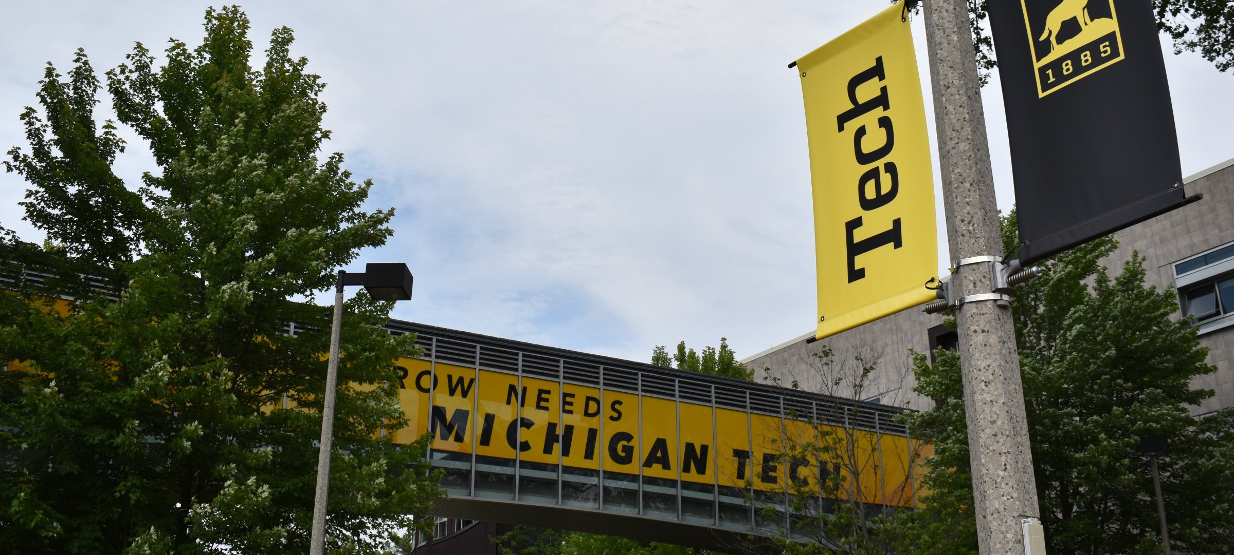 Tomorrow Needs Michigan Tech sign displayed at Van Pelt and Opie Library