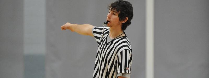 Referee blowing a whistle