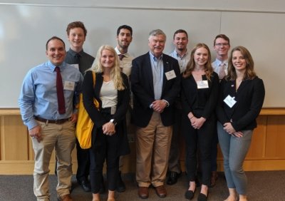 Students at conference with Tony England