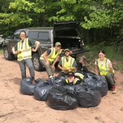 2020 kisma crew with bags of pulled garlic mustard