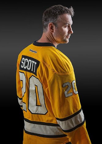 John Scott wore number 20 for the Hockey Huskies.