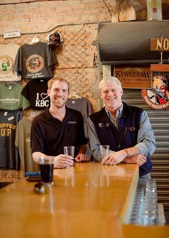 KBC Dick Gray of Keweenaw Brewing Company and son Ryan of Electric Brewing Supply sharing a drink at the KBC.