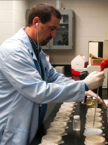 A lab worker tests water samples.