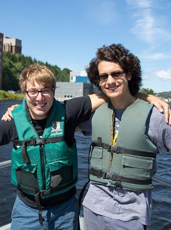 Two participants on a boat ride through the Portage Canal.