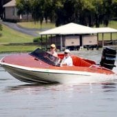 Shannon and Scott Knight in a motor boat.