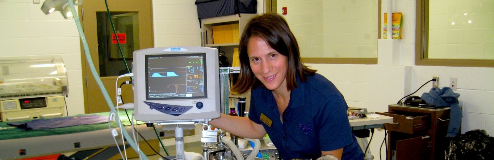 Erika Crook next to medical equipment.