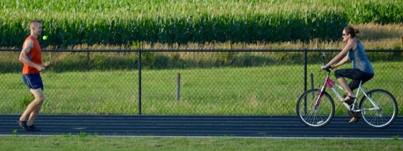 Bob Evans backward juggling on a track.