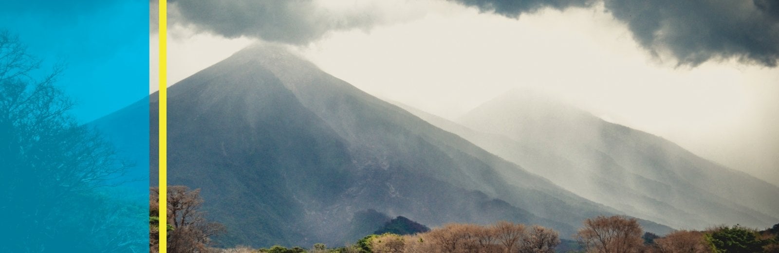 Smoke coming from the top of a volcano.