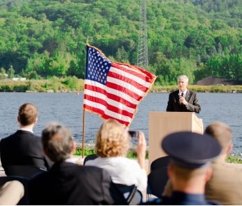 President Koubek at a podium speaking.