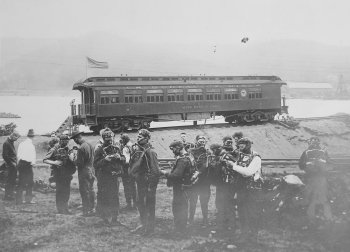 Soldiers preparing to baord a train.