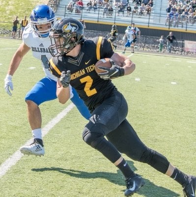 Jacob Wenzlick with the football avoiding a tackle.