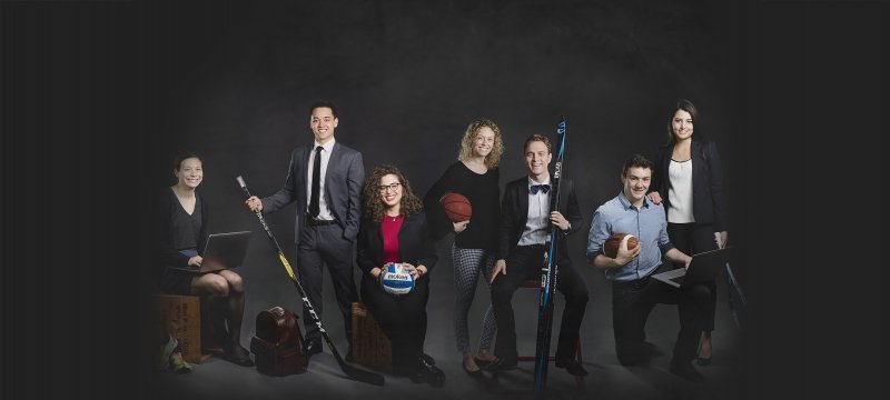 Seven athletes dressed up and holding their sports equipment.