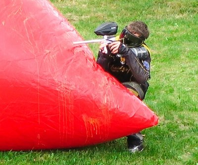 Person playing paintball.