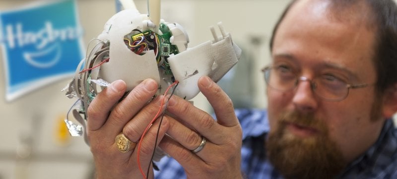 Aaron Arvia holding a prototype.