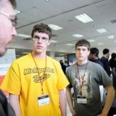 Students looking at posters at Design Expo.