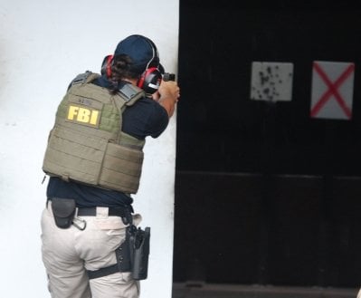 Nicole Lopez shooting at targets.