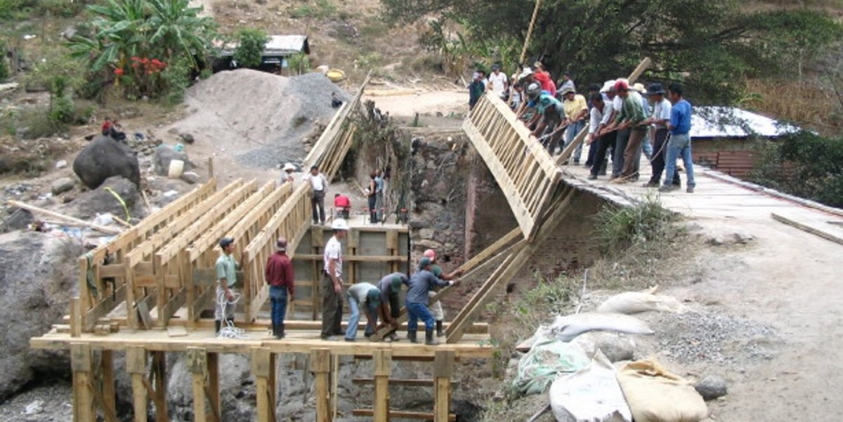 People building wooden bridge.