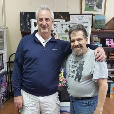 Tim and John standing together.