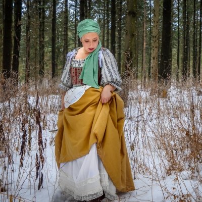 Sarah Jo Martens wearing the Goose Girl costume in a snowy forest.