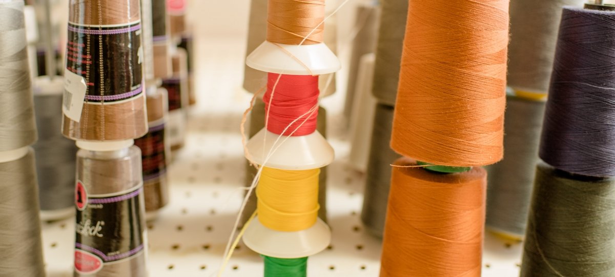 Spools of different color threads.