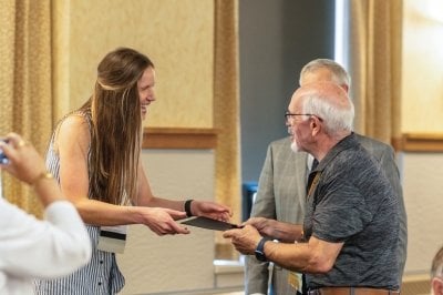 An alumnus receiving his Golden M award.