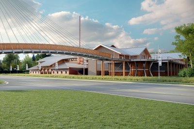 Rendering of a building with a bridge crossing the road.