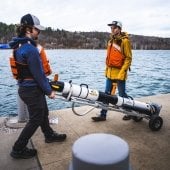 Bringing the IVER 3 to the dock on a dolly.