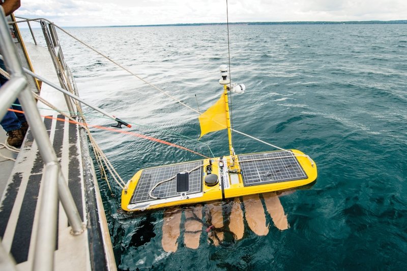 Wave glider being lowered into the water.