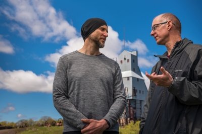 Roman Sidortsov and Timothy Scarlett talking near the Quincy Mine Hoist.