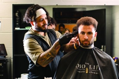 Person getting their hair cut.