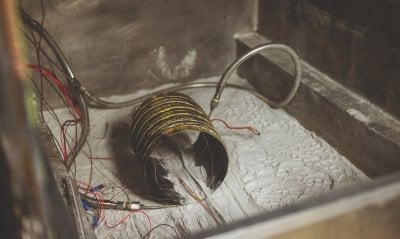 Piece of equipment being tested in the Dusty Thermal Vacuum Chamber.