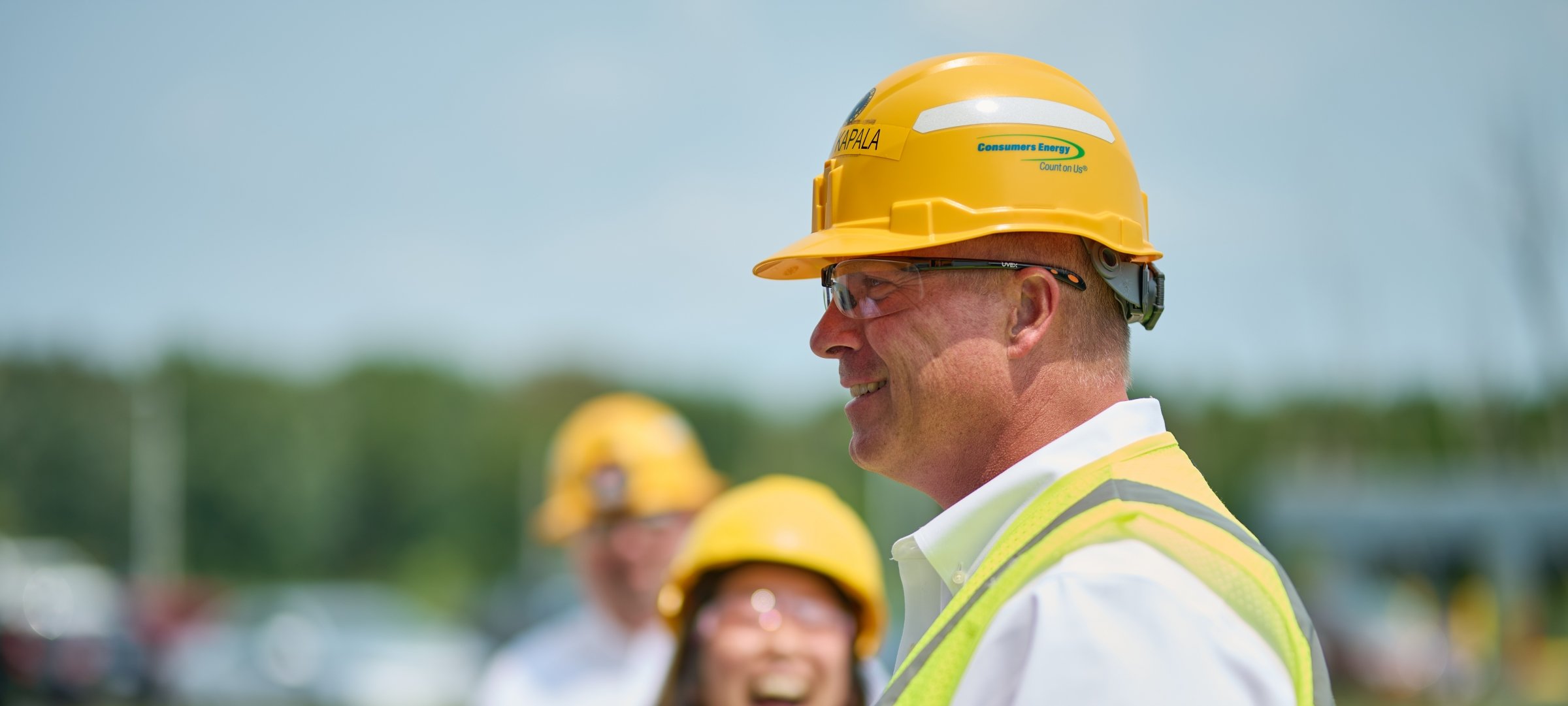 Man in profile wearing a Consumers Energy hardhat.