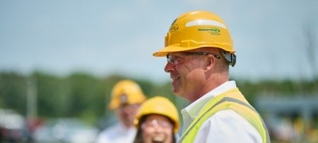 Man in profile wearing a Consumers Energy hardhat.