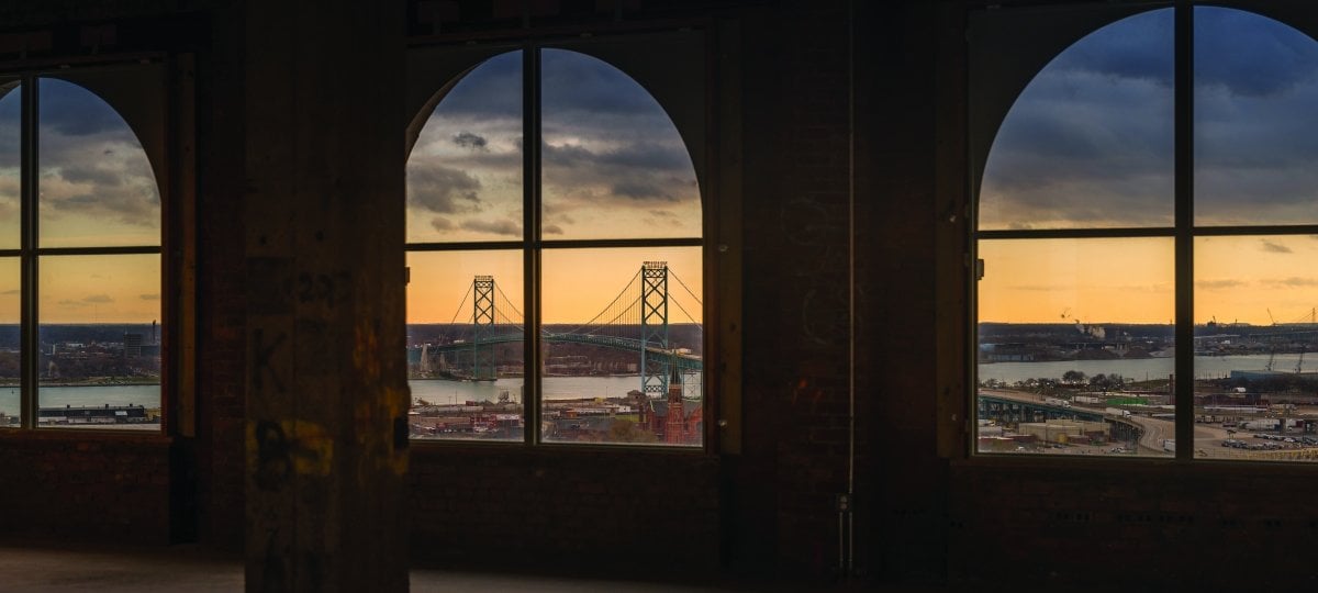 The Ambassador Bridge seen through the windows from inside the empty station.