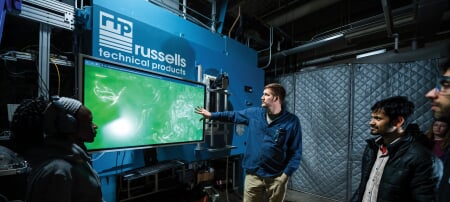 Graduate students analyze cloud formation data with research scientist Jesse Anderson, using the Pi Cloud Chamber to study atmospheric processes.