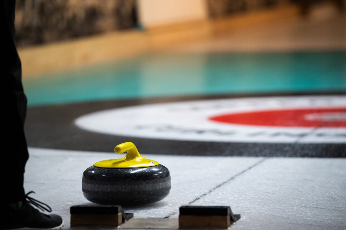 Close up of a curling stone on the ice.