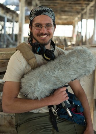 Chris Trevino sitting with his sound equipment