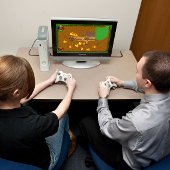 Two people sitting at a computer.