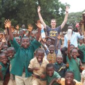 Student with children in Ghana.