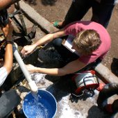 Student working with a water pipe.