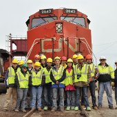 People in front of a train.