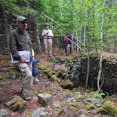 Several people in the woods.