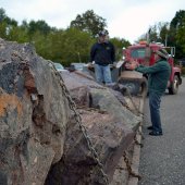 Unloading rocks from a trailer.