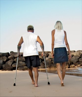 Bob and Ellen Raimo walking on beach