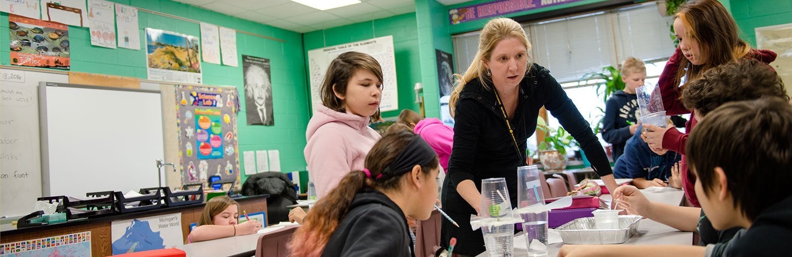 Jennifer Martin, L'Anse Jr/Sr High School, embraces hands-on science learning with her sixth-grade students by using new curriculum.