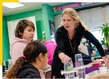 Jennifer Martin, L'Anse Jr/Sr High School, embraces hands-on science learning with her sixth-grade students by using new curriculum.