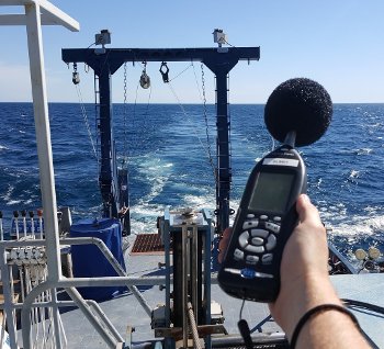Barnard measures the sound pressure levels on the work deck of the Blue Heron. They range from 75 to 80 dBA.